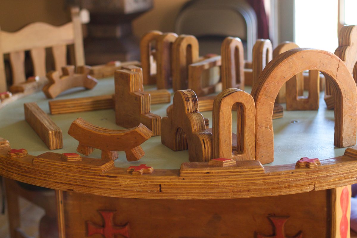 Wooden building blocks on a table in a childcare playroom