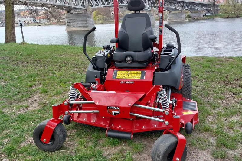 Zero-turn mowers lined up ready for work