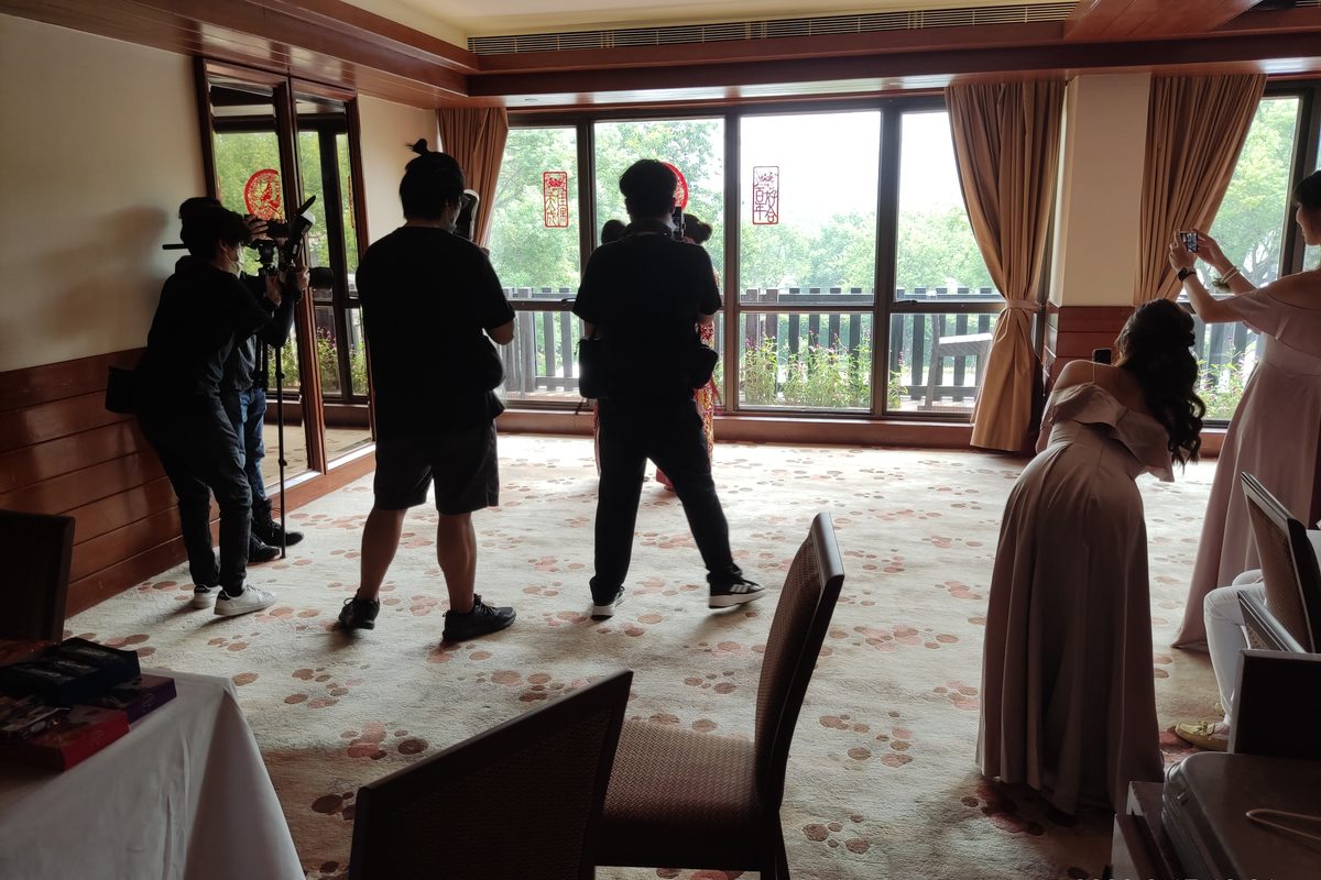 Wedding photographers working with cameras at an event